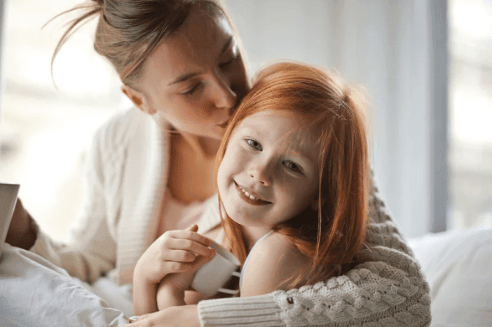 mom and daughter smiling